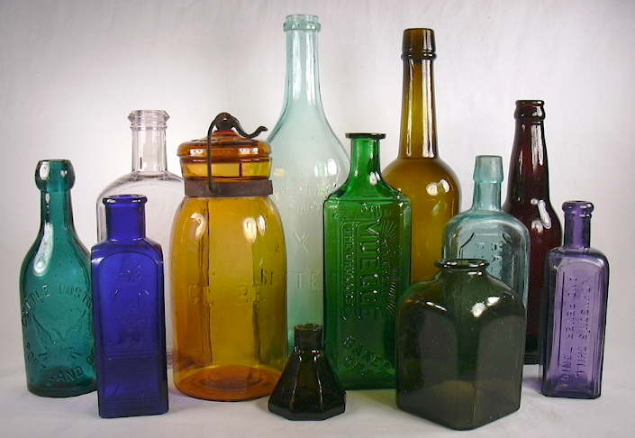 Old fashioned glass bottle in dark amber tones