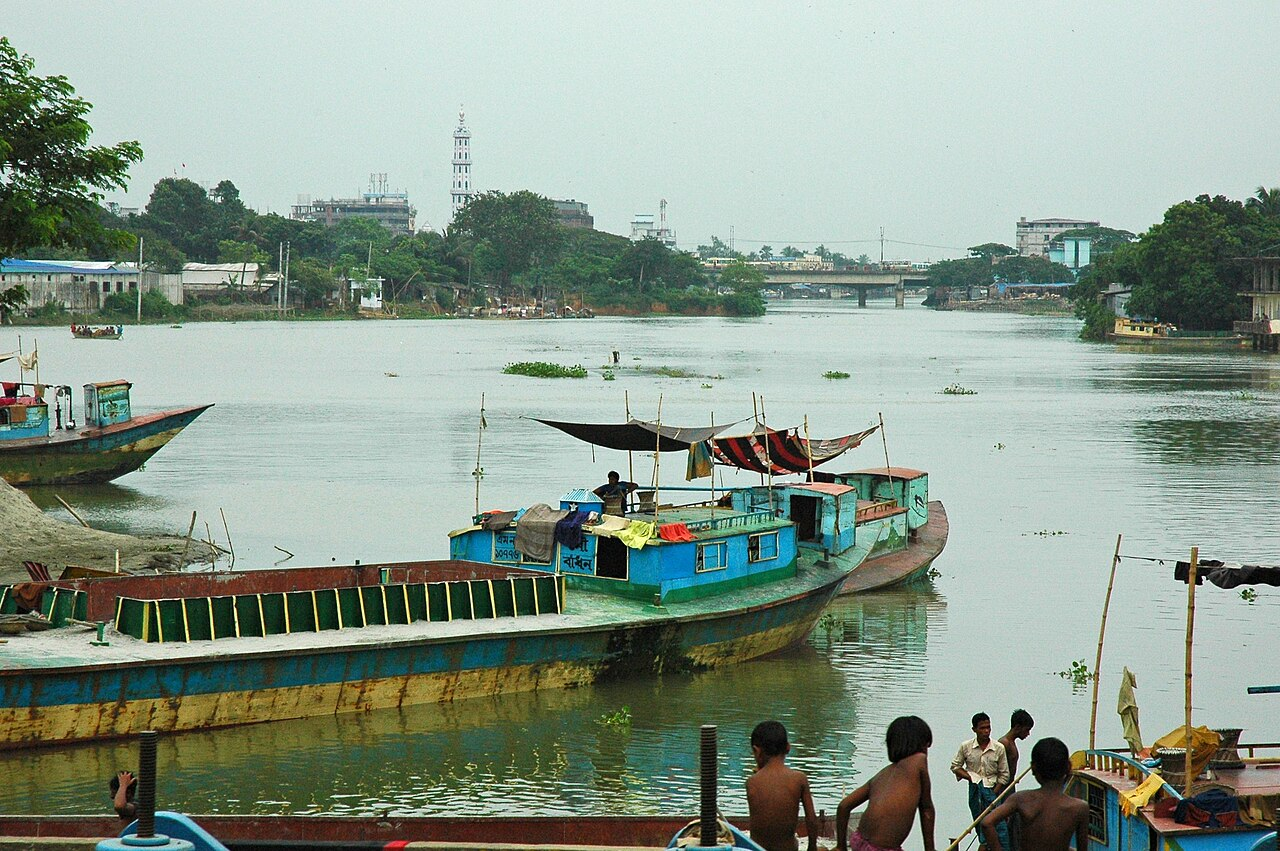Boats and people on the Turag River, Dhaka, Bangladesh